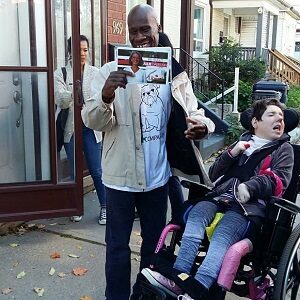 Two participants distributing flyers in the community.